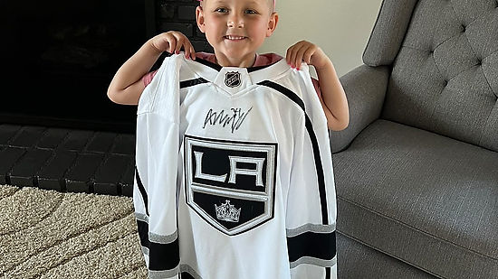 Autumn receives a signed jersey from LA Kings Arthur Kaliyev